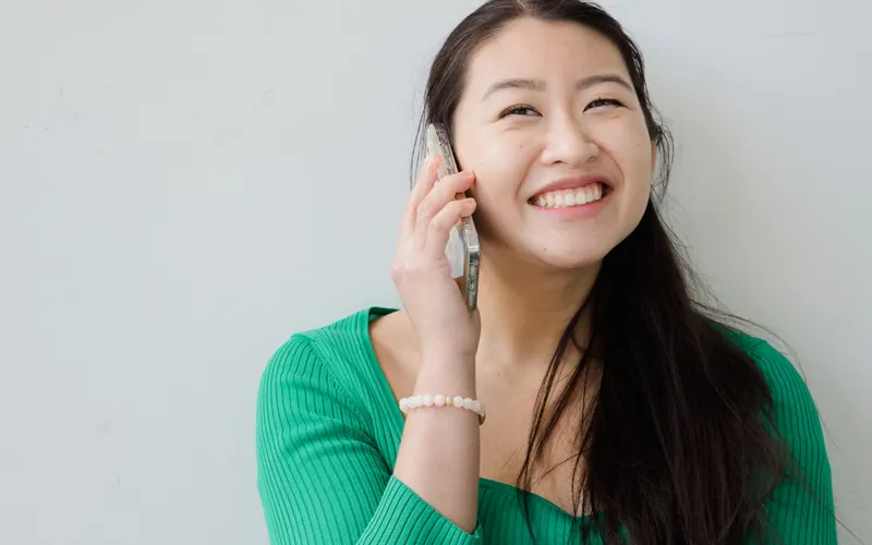Smiling woman talking on her phone